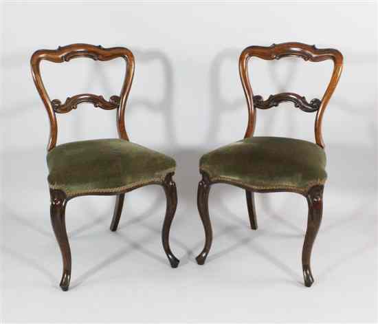 Appraisal: A set of four Victorian carved mahogany dining chairs with