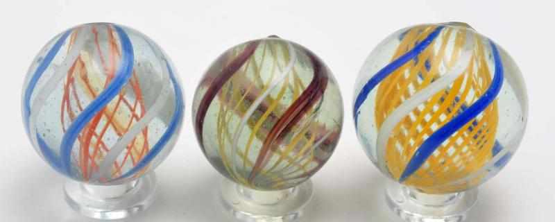 Appraisal: Lot of Latticino Swirl Marbles Description The first marble is