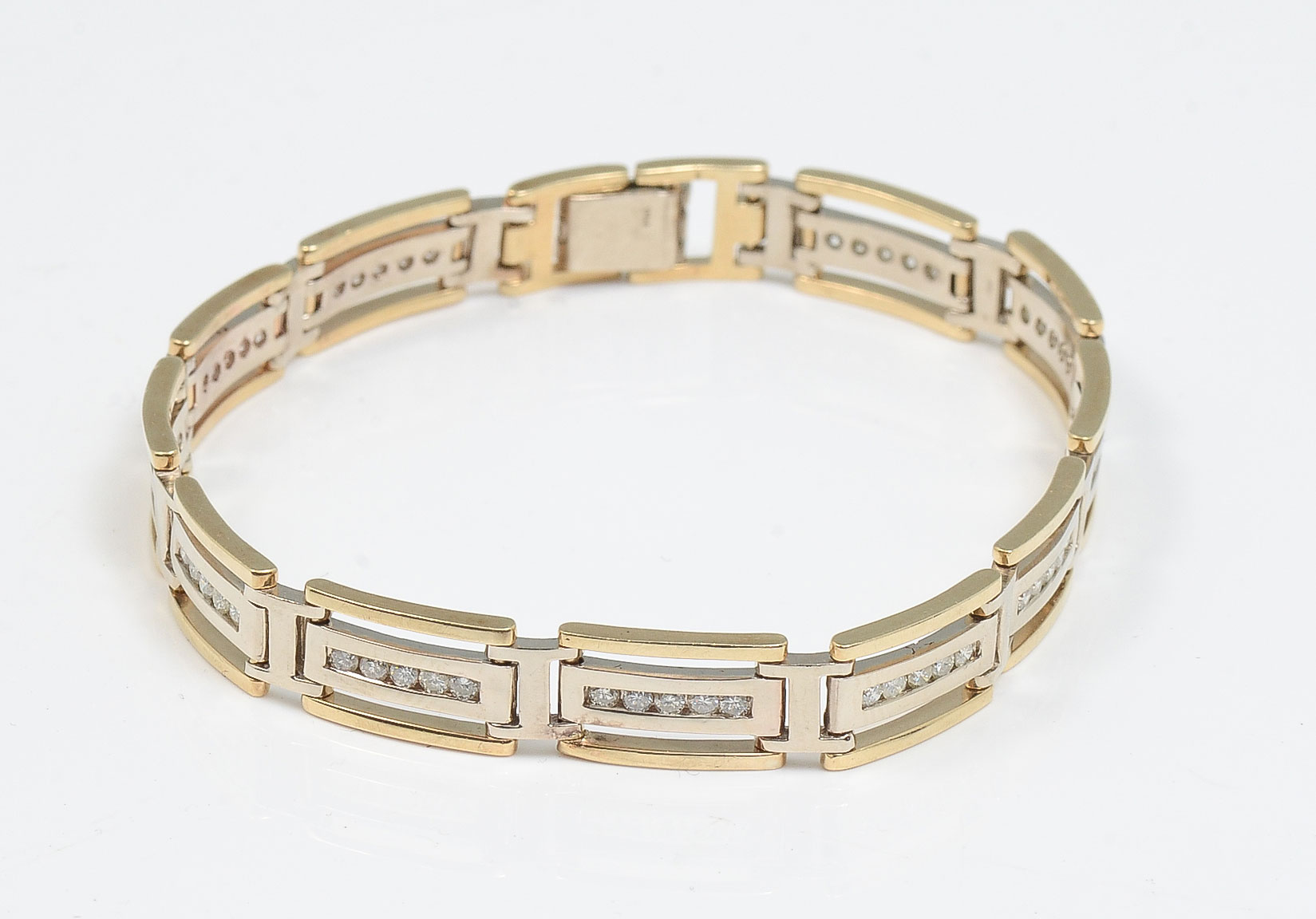 Appraisal: TONE K PANEL DIAMOND SET BRACELET Each of the panels