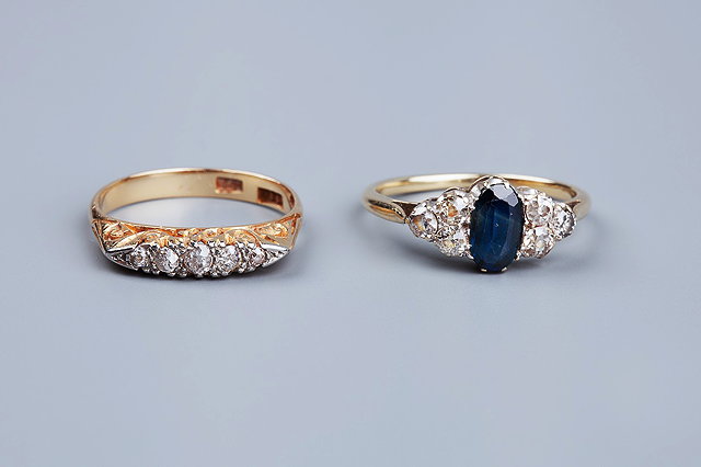 Appraisal: FOUR GEM SET RINGS comprising a sapphire and diamond dress