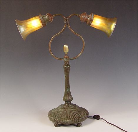 Appraisal: TIFFANY STYLE LAMP WITH QUEZAL ART GLASS SHADES Patinated metal