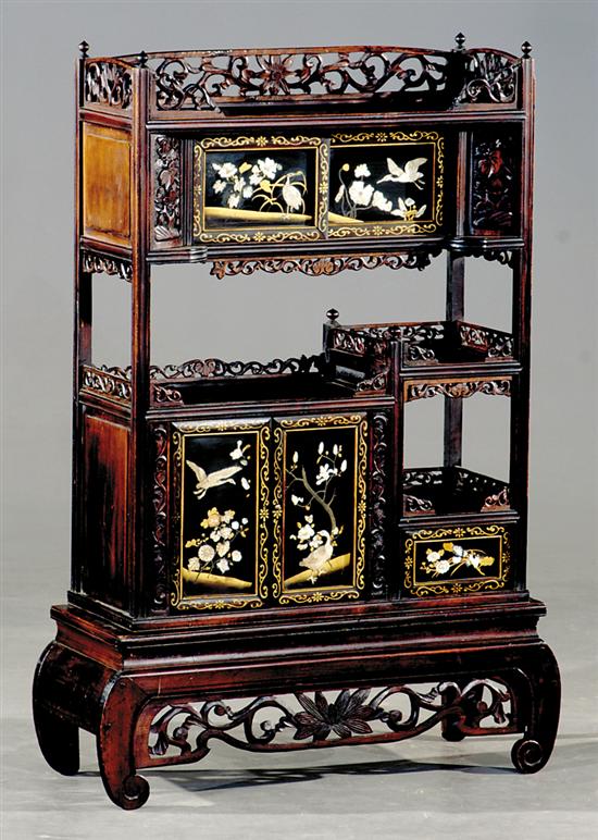 Appraisal: Oriental carved hardwood and mother-of-pearl whatnot circa pierce-carved galleries over