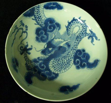 Appraisal: A K'ang Hsi saucer shaped dish the centre finely painted