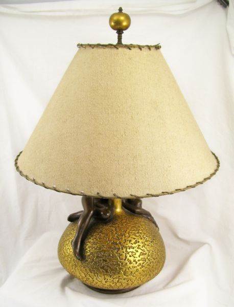 Appraisal: Nude Figural Pottery Table Lamp Glazed pottery with a gold