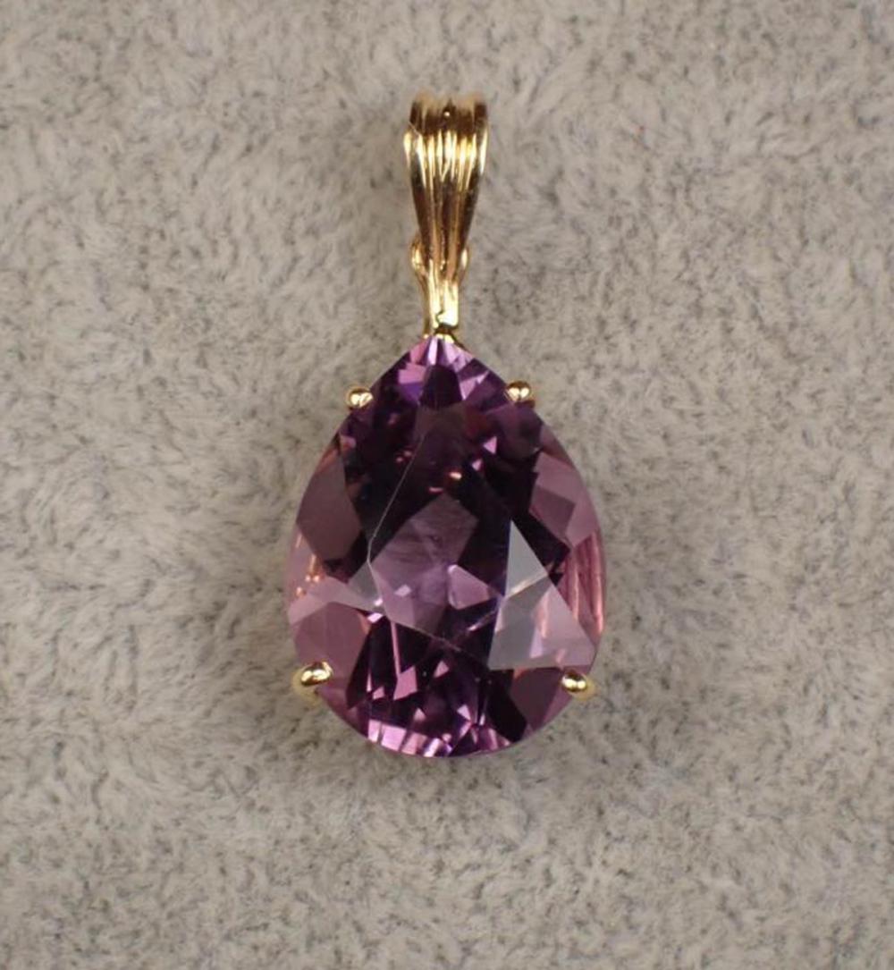 Appraisal: AN AMETHYST PENDANT K yellow gold single pear-cut amethyst estimated