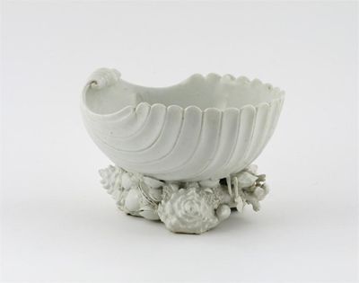 Appraisal: A Bow white-glazed salt modelled as a large shell resting