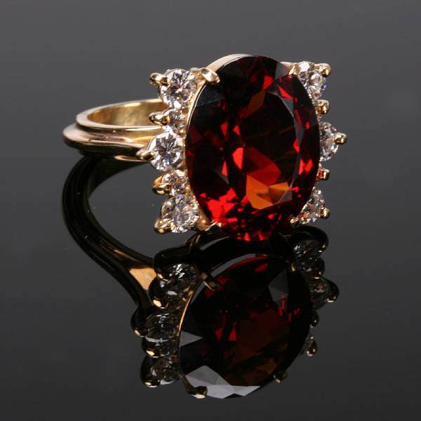 Appraisal: A hessonite garnet diamond and k gold ring estimated total