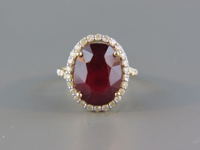 Appraisal: Ruby Diamond Ring carat oval gem surrounded by diamonds totaling