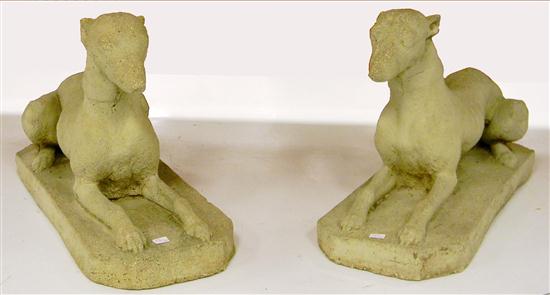 Appraisal: Garden sculptures a pair of carved dog sculptures two whippets