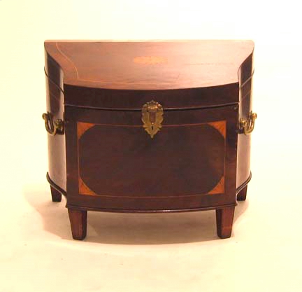 Appraisal: George III mahogany and satinwood serpentine cellarette The hinged shaped