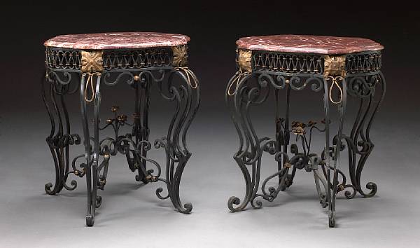 Appraisal: A pair of Renaissance style iron t le and marble