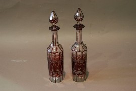 Appraisal: A pair of Bohemian ruby flash glass decanters with stoppers