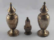 Appraisal: A pair of silver baluster peppers marked sterling ht cm