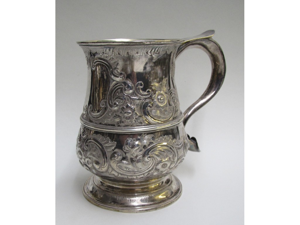 Appraisal: A George III silver baluster tankard embossed and chased with