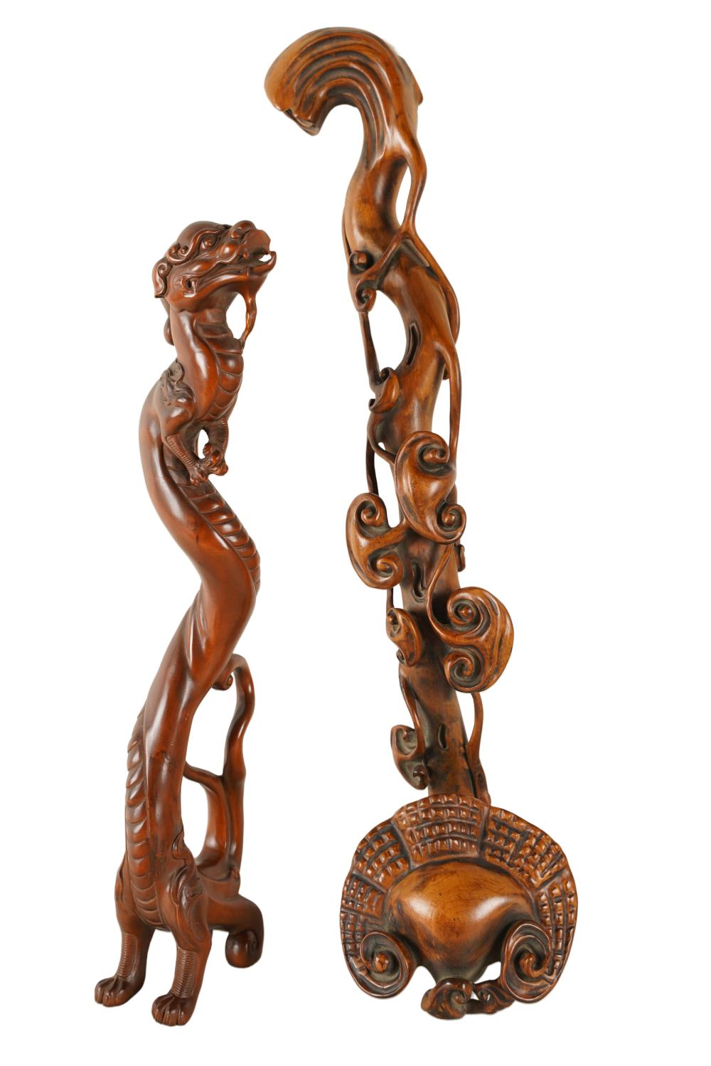 Appraisal: TWO CHINESE WOOD CARVINGScomprising a ryu scepter and a mythical