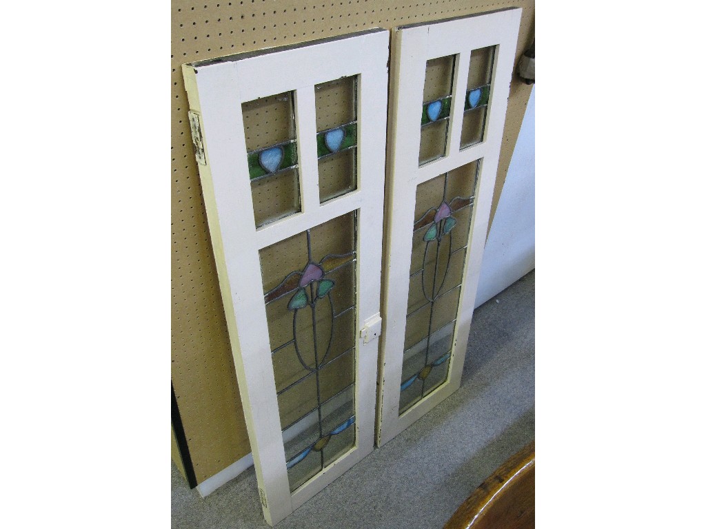 Appraisal: Pair of Arts and Crafts leaded and stained glass cupboard