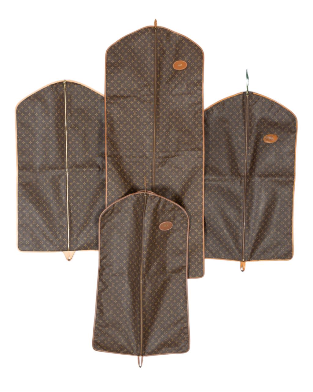 Appraisal: FOUR LOUIS VUITTON MONOGRAM GARMENT BAGS Four Louis Vuitton monogram