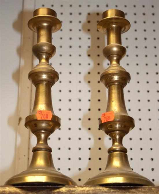 Appraisal: Pair of Continental brass push-up candlesticks Estimate - No condition