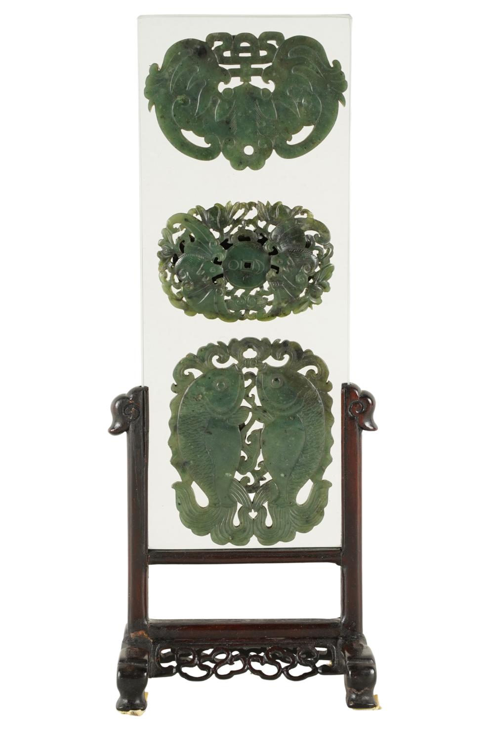 Appraisal: THREE CHINESE HARDSTONE PLAQUESmounted in a glass frame on a