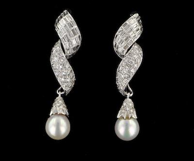 Appraisal: A Pair of Diamond and Pearl Earrings Mounted in platinum