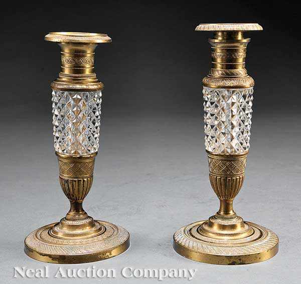 Appraisal: Two Bronze and Cut Crystal Candlesticks th c with elaborate