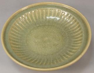 Appraisal: Large Chinese celadon glazed ceramic deep charger with incised flower