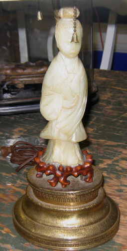 Appraisal: JADITE QUAN YIN FIGURE In a recumbent standing position very