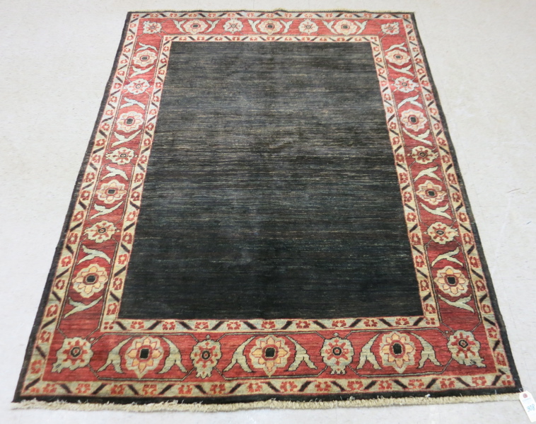 Appraisal: HAND KNOTTED ORIENTAL AREA RUG Pakistani Zeigler featuring a rectangular