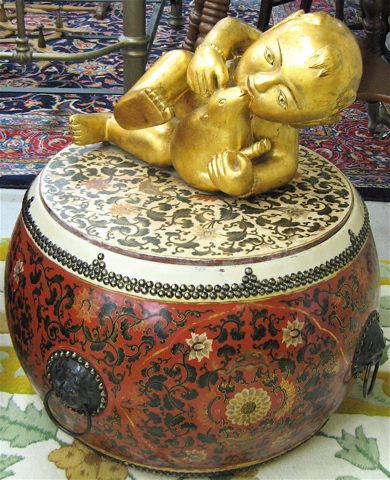 Appraisal: TWO CHINESE DECORATIVE ARTS OBJECTS recumbent giltwood figure on drum-form