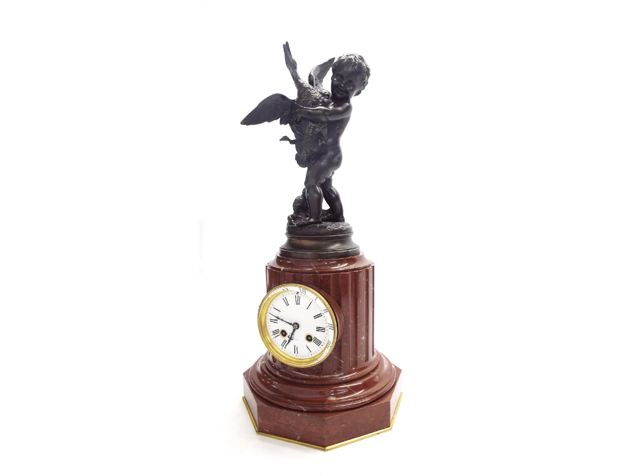 Appraisal: French bronze and red marble two train figural pillar clock