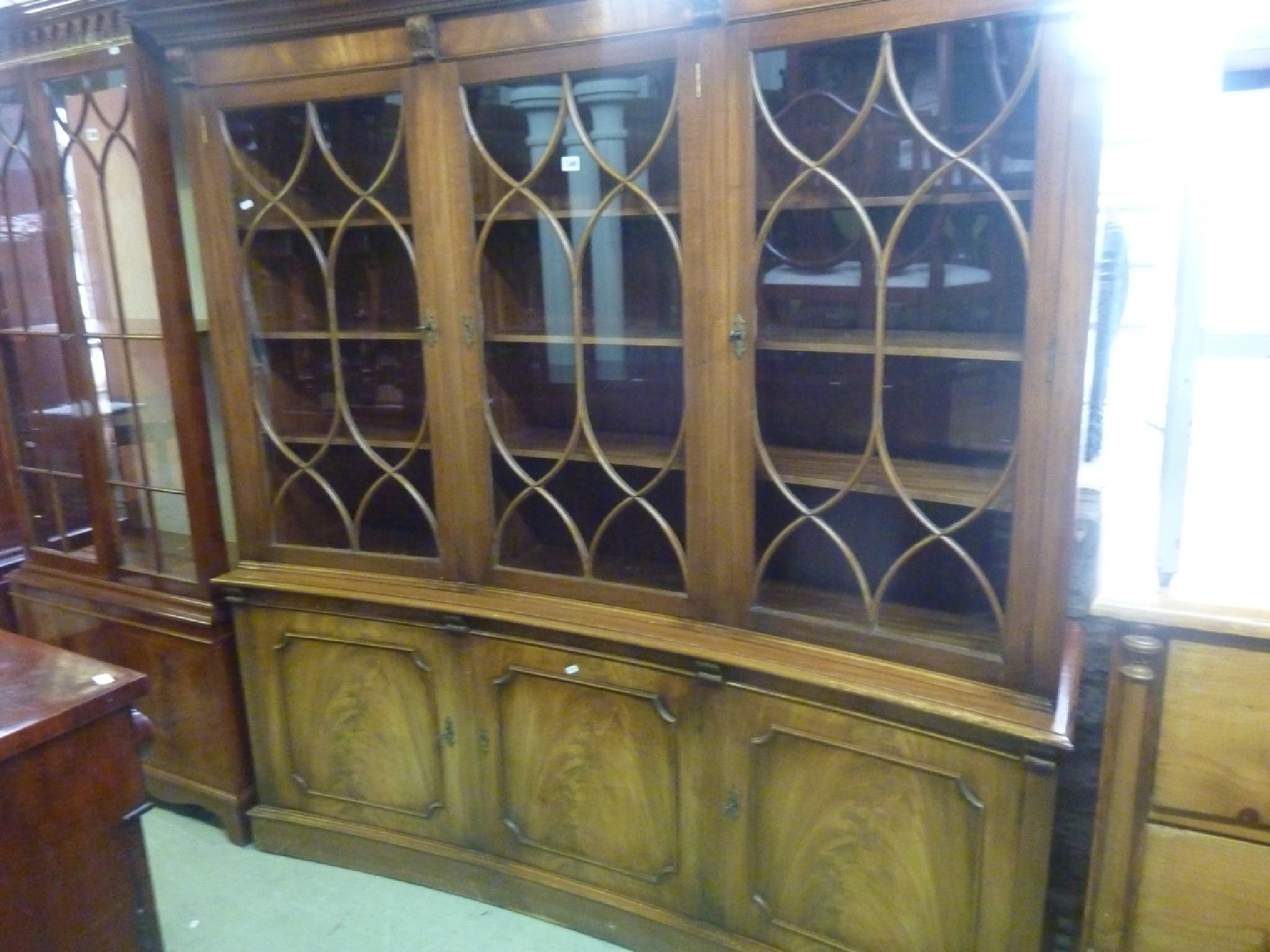 Appraisal: A good quality Georgian style -sectional bookcase of convex outline