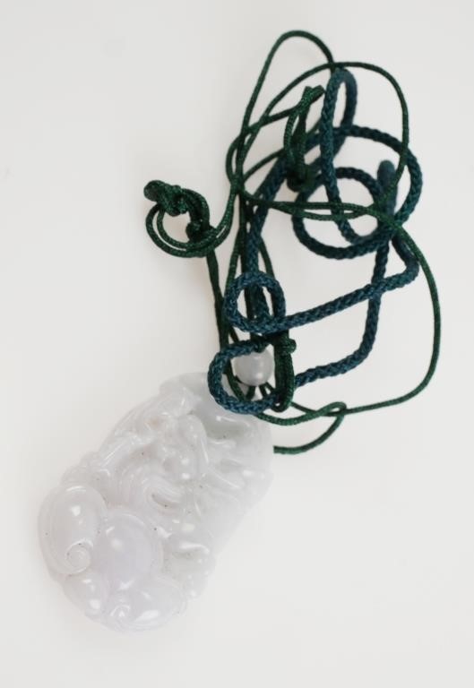 Appraisal: Carved and polished white Chinese jade dragon pendant with braided