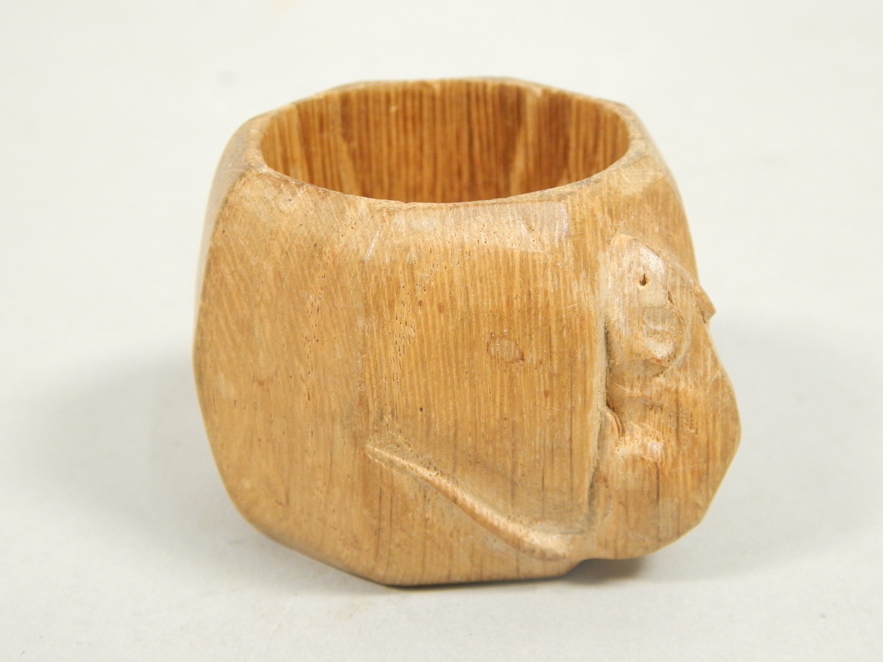 Appraisal: Robert Mouseman Thompson A faceted oak napkin ring carved with