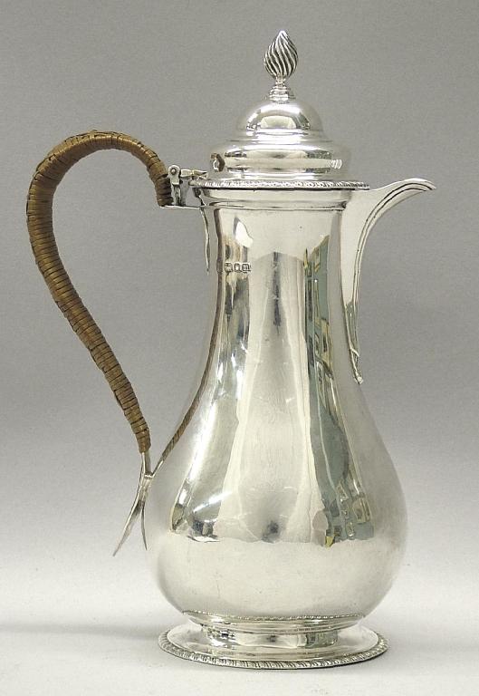 Appraisal: Edwardian baluster coffee pot of plain form with a reeded