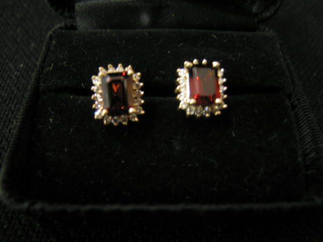 Appraisal: Garnet Diamond Earrings emerald cut gems surrounded by diamonds in