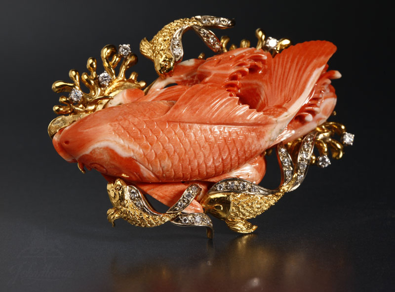 Appraisal: An K yellow gold coral and diamond fish brooch An