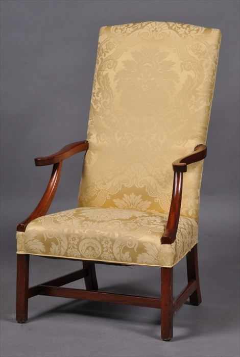 Appraisal: FEDERAL-STYLE MAHOGANY LOLLING CHAIR With padded raked backrest s-scroll armrests