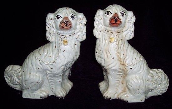 Appraisal: A pair of Staffordshire dogs with gilt padlock and chains