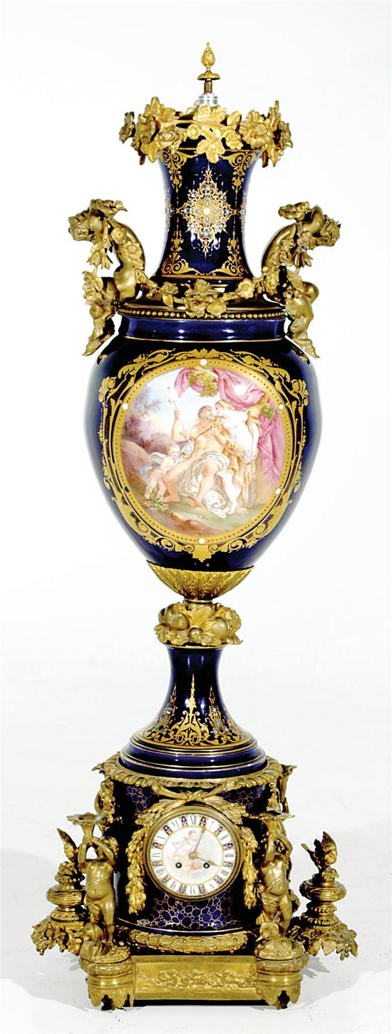 Appraisal: Monumental French ormolu-mounted porcelain urn with clock th century foliate