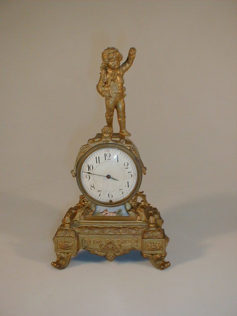 Appraisal: A thC French gilt metal figural table clock