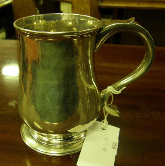 Appraisal: A GEORGE II PLAIN SILVER BALUSTER MUG with scroll handle