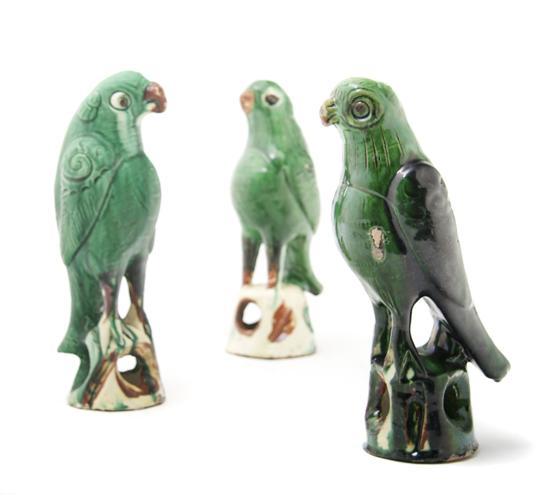 Appraisal: A Group of Three Chinese Ceramic Parrots having green glaze