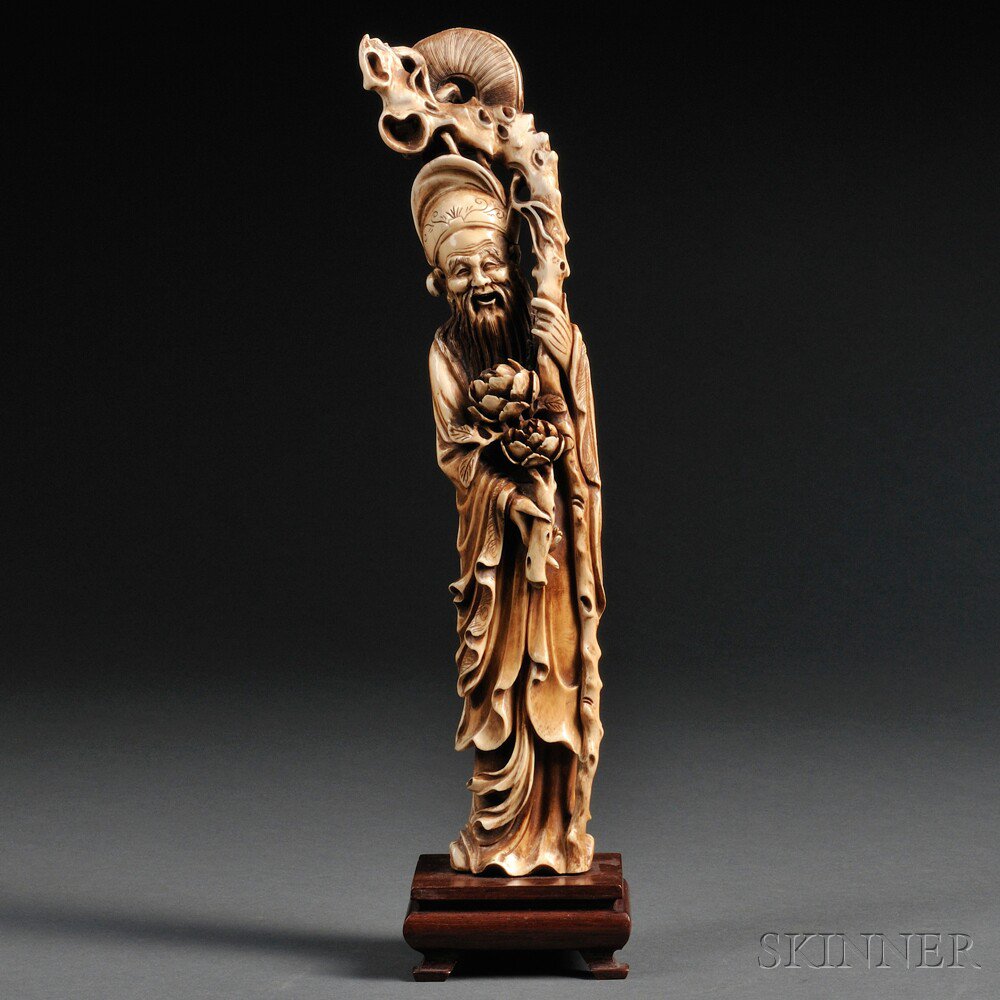 Appraisal: Ivory Carving of Shoulao China th century standing holding a