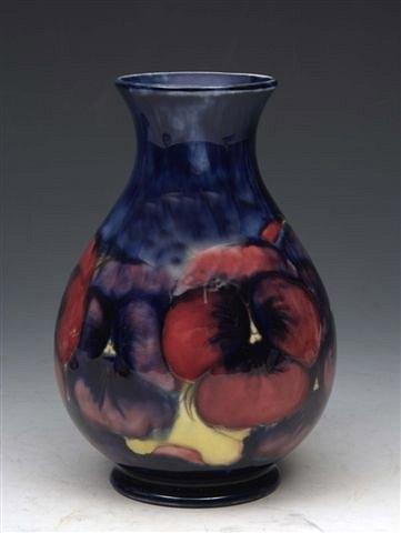 Appraisal: A MOORCROFT 'PANSY' BALUSTER VASE on dark blue ground high