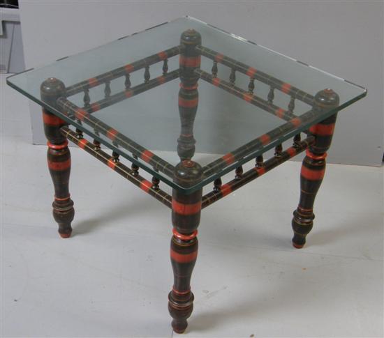 Appraisal: Glass top coffee table on red and black turned supports