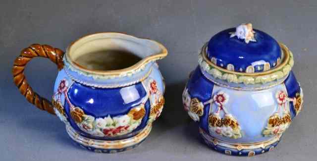 Appraisal: MAJOLICA CREAMER AND COVERED SUGARBOWLMatching cream sugar with twisted rope