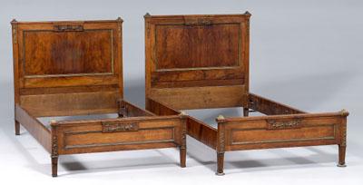 Appraisal: Pair Louis XVI style bedsteads each with figured walnut veneers