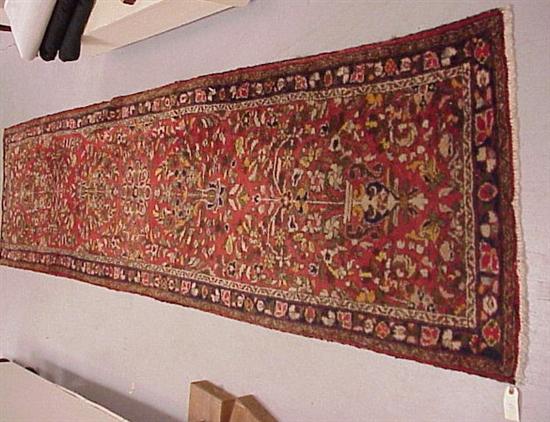 Appraisal: Semi-antique Persian Hamadan runner red field with repeated stylized flowers