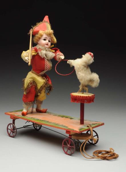 Appraisal: Mechanical Circus Pull Toy Bisque head circus performer moves his