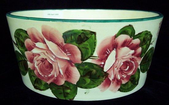 Appraisal: A Wemyss dog bowl painted with roses and the humorous